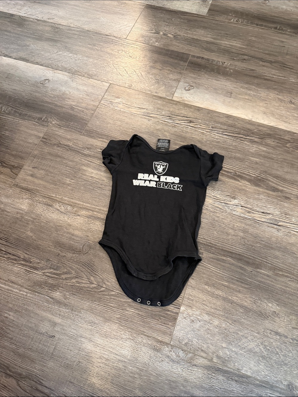 NFL Oakland‎ Raiders 'Real Kids Wear Black' Black Baby One-Piece
